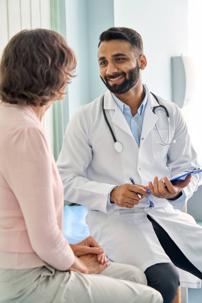 A clinician advises a patient on radiofrequency ablation side effects before moving forward with treatment.