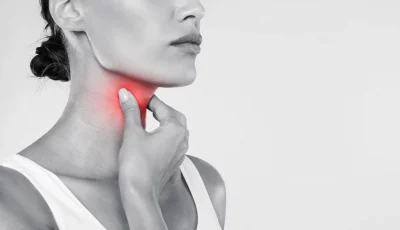 Black and white image of woman’s neck with the throat tinged red, indicating thyroid malignancy.